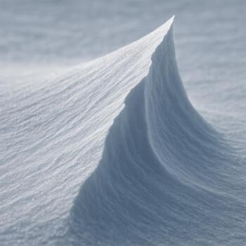 Snow drifts forming a curved ridge line on the ice